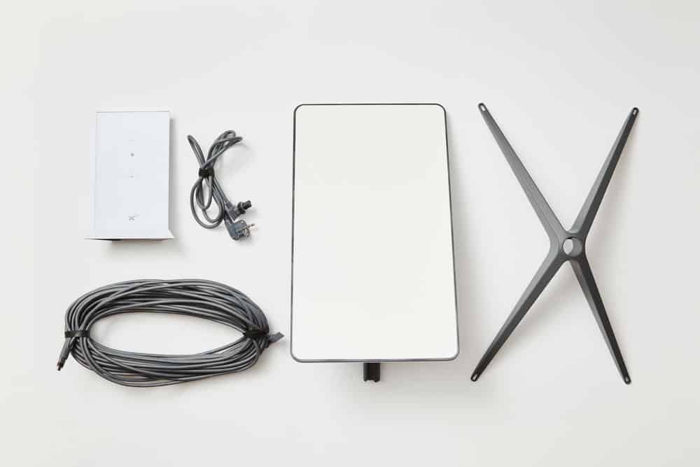 Basic Starlink kit, antenna, wi-fi router, base, and cables