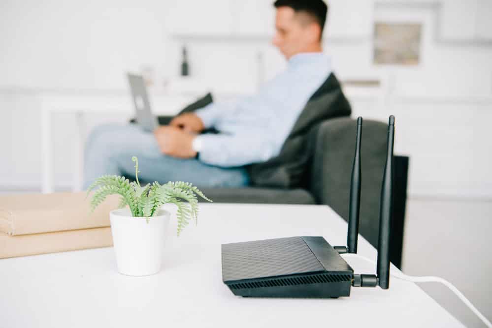 Businessman using the internet from a router