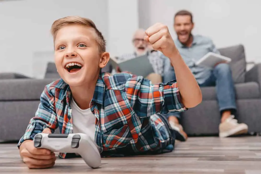 A boy plays video games. 