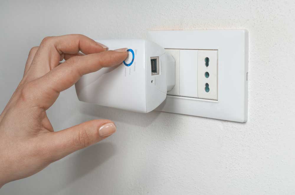 Plugging a WiFi Extender.