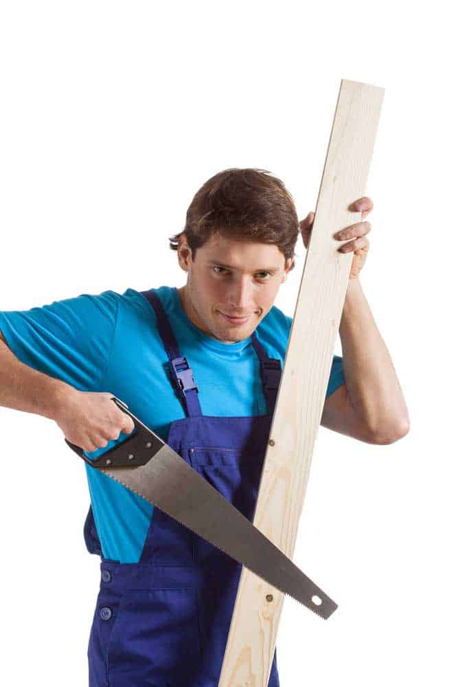 A man with a 2x4 timber plank.