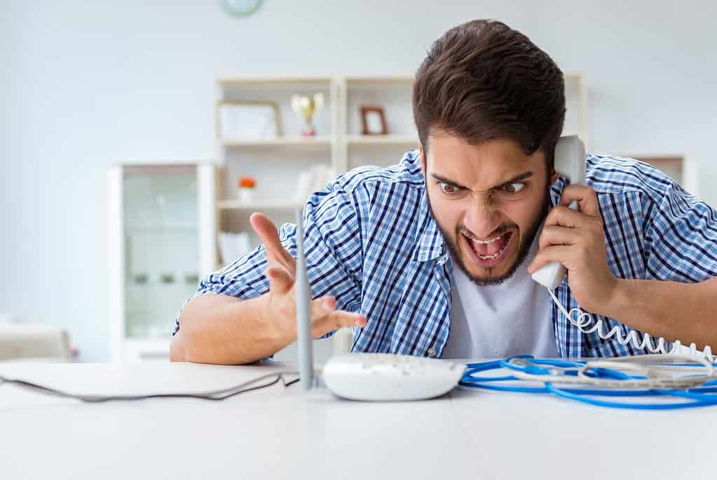 A young man frustrated by poor internet.