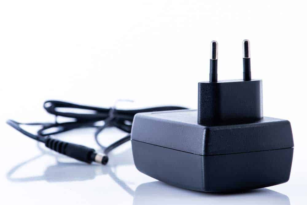 A router power supply plug.