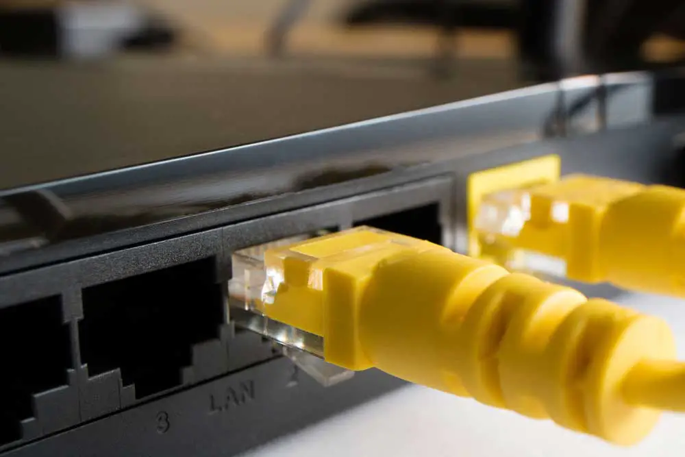 Cables inserted into Ethernet ports.