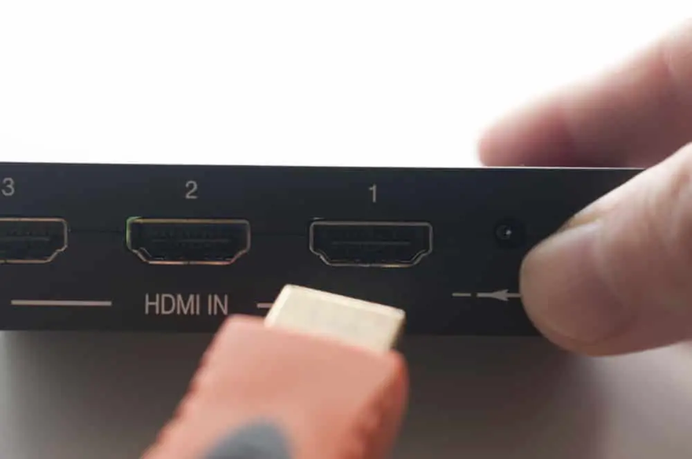 An HDMI Cable is connecting to a Roku Device. 