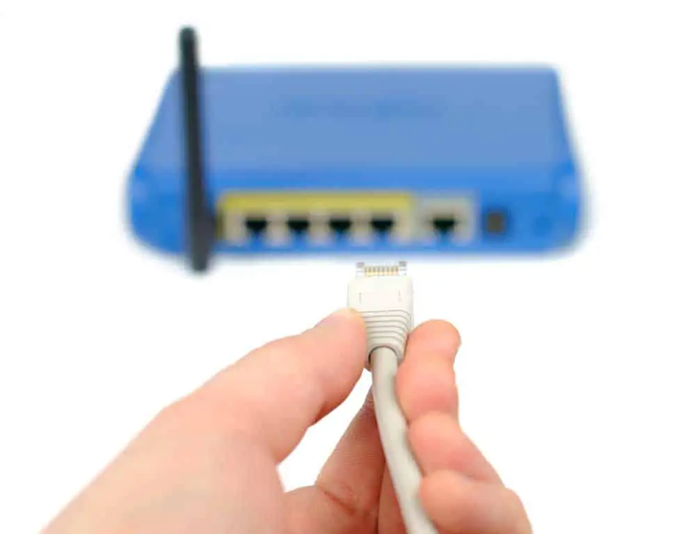 A WiFi router and an Ethernet cable