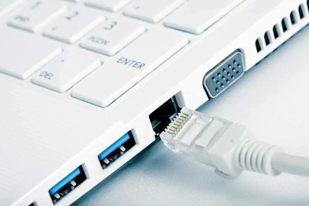 Connecting a Network Cable to a Computer. 