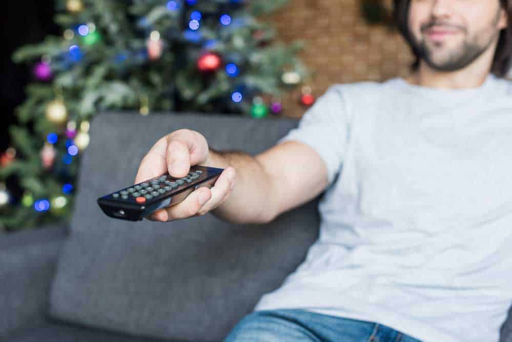 A Man Using a Remote Control.